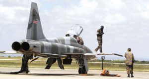 Kenya Air Force troops attend to an F-5E Tiger II fighter jet